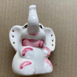 - porcelain good luck charm elephant toothpick, makeup brushes, candle holder